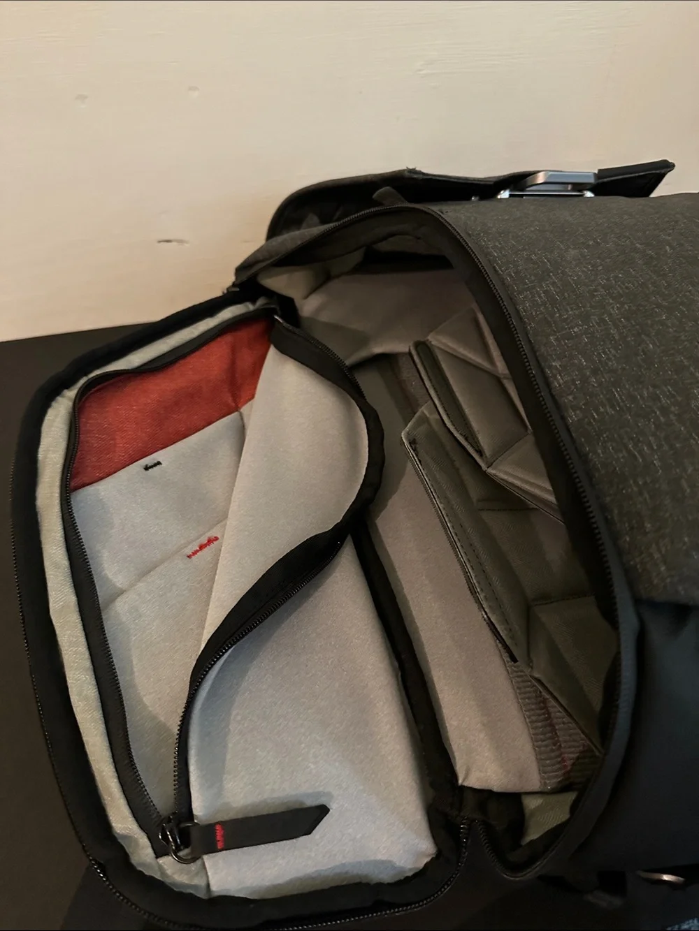 Peak Design Dark Gray Everyday Backpack with Red Accent.